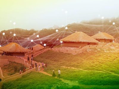 Rural village in India with traditional huts connected by a digital network overlay, representing internet connectivity and Digital India initiatives