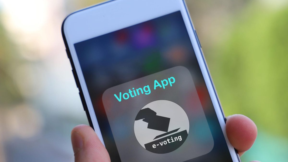 Close-up of a smartphone displaying a digital voting app interface for online e-voting and electronic election systems.